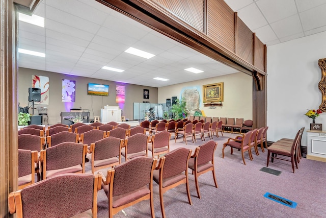 misc room with visible vents, a drop ceiling, and carpet floors