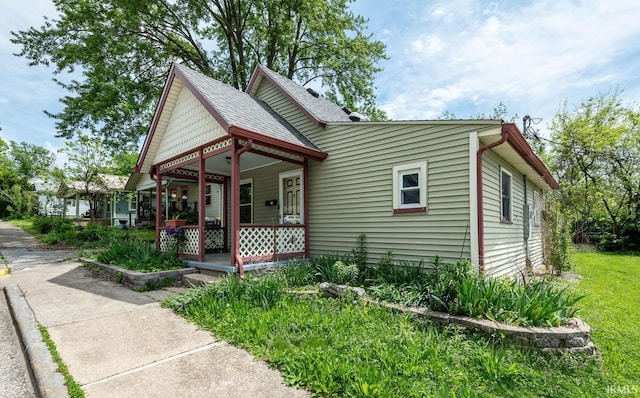 victorian house featuring a porch