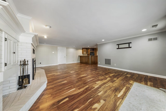 1711 Old Plank Rd, Newburgh, IN 47630 - unfurnished living room with a fireplace, wood finished floors, ornamental molding, recessed lighting, and baseboards