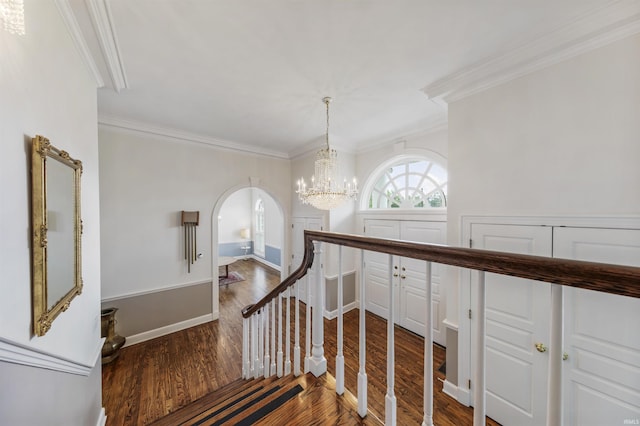 1711 Old Plank Rd, Newburgh, IN 47630 - stairs featuring crown molding, wood finished floors, arched walkways, a chandelier, and baseboards
