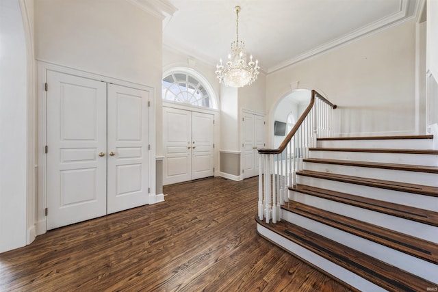 1711 Old Plank Rd, Newburgh, IN 47630 - foyer entrance featuring ornamental molding, a chandelier, stairs, dark wood finished floors, and baseboards