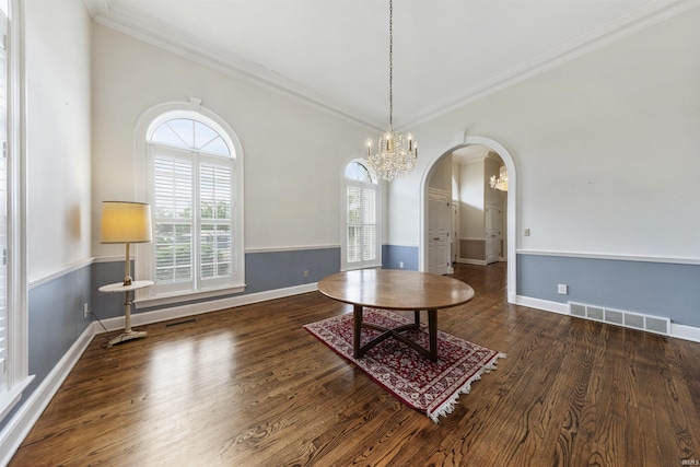 1711 Old Plank Rd, Newburgh, IN 47630 - dining room featuring arched walkways, crown molding, a chandelier, wood finished floors, and baseboards