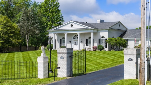 1711 Old Plank Rd, Newburgh, IN 47630 - greek revival inspired property with covered porch, a gate, and driveway