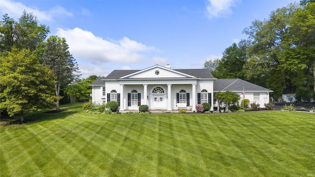 1711 Old Plank Rd, Newburgh, IN 47630 - neoclassical / greek revival house featuring a front yard, covered porch, and a chimney