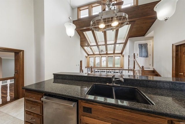 1711 Old Plank Rd, Newburgh, IN 47630 - kitchen with a sink, dishwasher, high vaulted ceiling, dark stone counters, and brown cabinetry