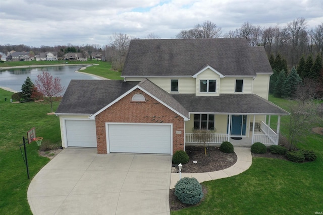 view of front of property with covered porch, a garage, roof with shingles, a front yard, and concrete driveway