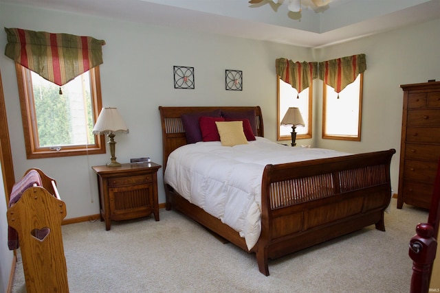 carpeted bedroom featuring baseboards