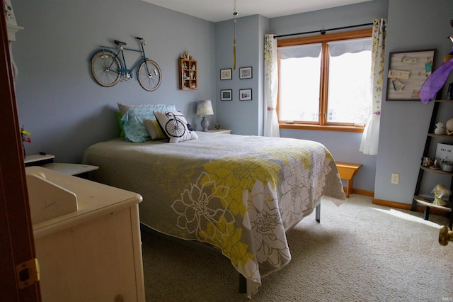carpeted bedroom with baseboards