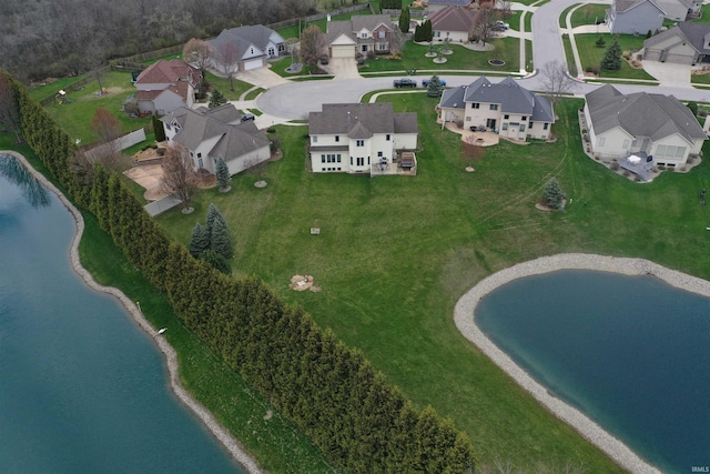 aerial view with a residential view and a water view