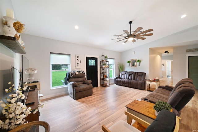 living room with recessed lighting, ceiling fan, light wood finished floors, baseboards, and lofted ceiling