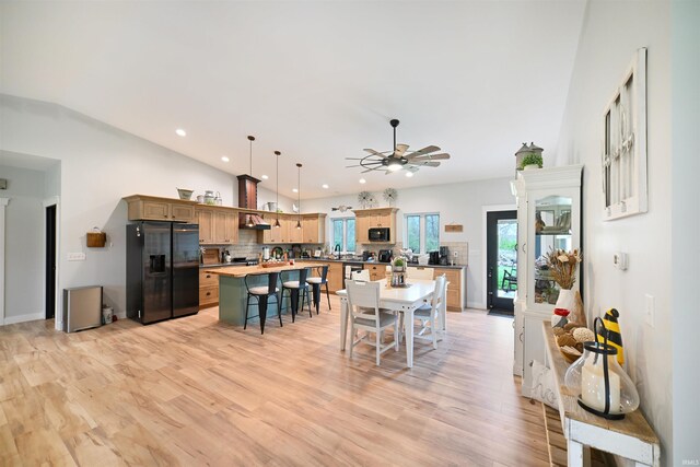 dining room featuring recessed lighting, ceiling fan, light wood-style flooring, and lofted ceiling