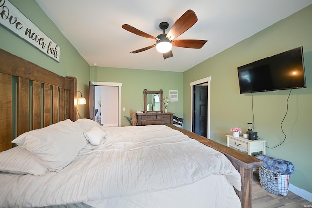 bedroom featuring ceiling fan and wood finished floors