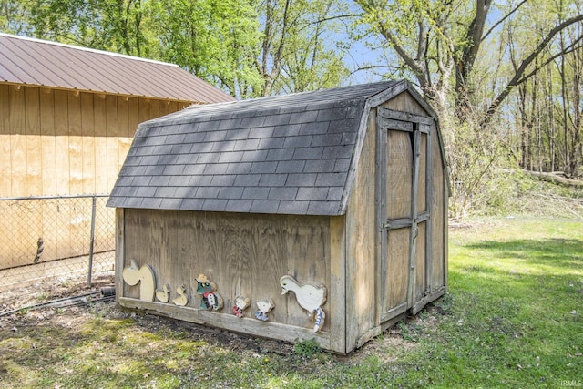 view of shed with fence