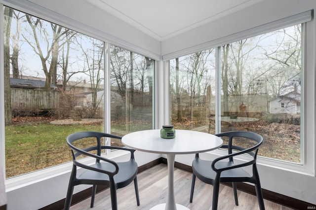 1509 W Glenn Ellyn Dr Unit 9Sfam, Homes Total, Muncie, IN 47304 - sunroom / solarium featuring wood finished floors and baseboards