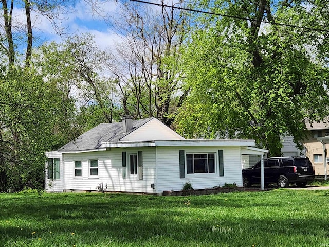 1509 W Glenn Ellyn Dr Unit 9Sfam, Homes Total, Muncie, IN 47304 - ranch-style home featuring a front lawn