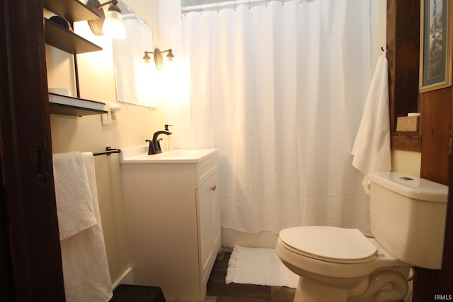 1509 W Glenn Ellyn Dr Unit 9Sfam, Homes Total, Muncie, IN 47304 - full bathroom featuring toilet, vanity, and a shower with shower curtain