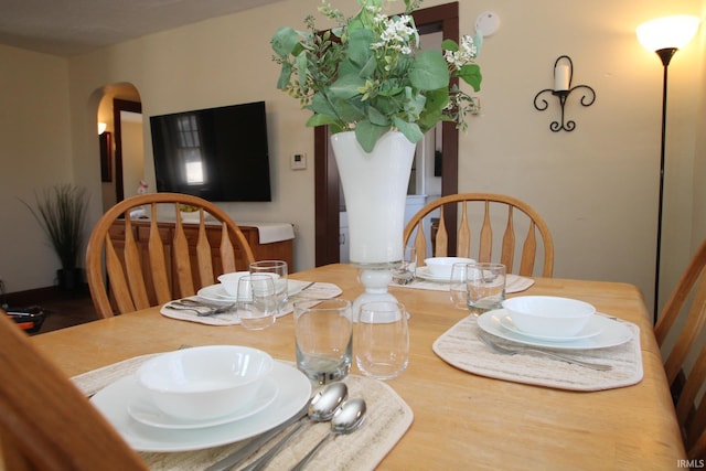 1509 W Glenn Ellyn Dr Unit 9Sfam, Homes Total, Muncie, IN 47304 - dining space with arched walkways and wood finished floors