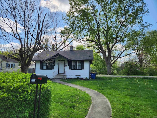 1509 W Glenn Ellyn Dr Unit 9Sfam, Homes Total, Muncie, IN 47304 - bungalow-style house featuring a front lawn and a chimney
