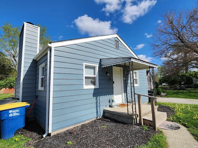1509 W Glenn Ellyn Dr Unit 9Sfam, Homes Total, Muncie, IN 47304 - view of front of house featuring a chimney