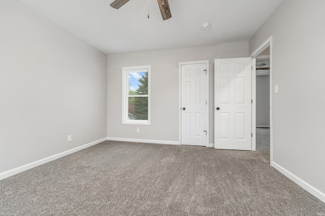 unfurnished bedroom featuring baseboards, ceiling fan, and carpet floors