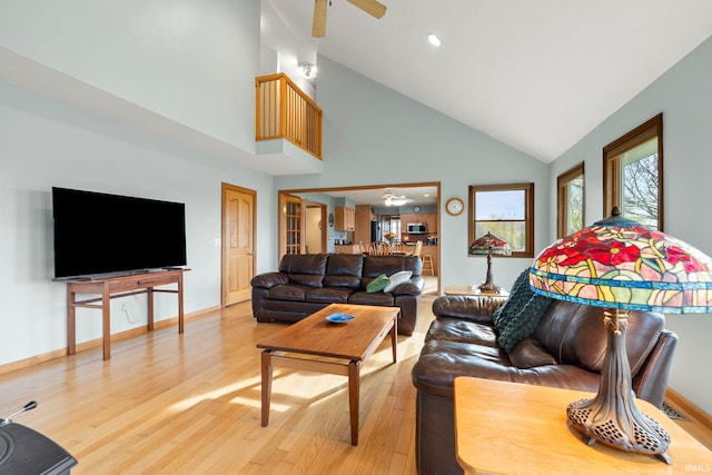 1808 County Road 18th Rd, Waterloo, IN 46793 - living area featuring light wood finished floors, high vaulted ceiling, a ceiling fan, recessed lighting, and baseboards