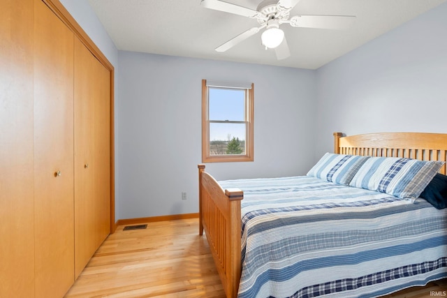 1808 County Road 18th Rd, Waterloo, IN 46793 - bedroom with ceiling fan, light wood-style floors, baseboards, visible vents, and a closet