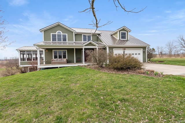 1808 County Road 18th Rd, Waterloo, IN 46793 - view of front of house featuring a garage, a front lawn, driveway, and a standing seam roof
