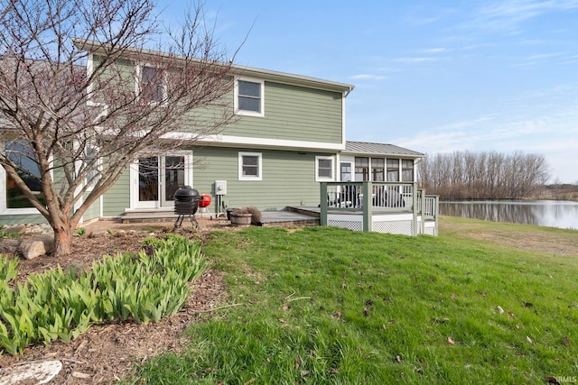 1808 County Road 18th Rd, Waterloo, IN 46793 - rear view of property featuring a lawn, a deck with water view, and a sunroom