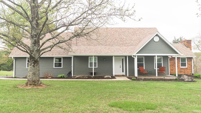 6021 N Timberline Dr, Bloomington, IN 47404 - ranch-style house with a porch, a front yard, roof with shingles, and a chimney
