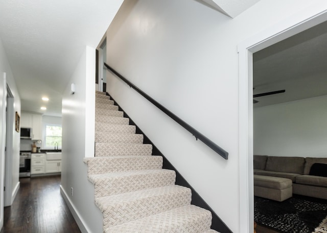 6021 N Timberline Dr, Bloomington, IN 47404 - stairs featuring wood finished floors, ceiling fan, and recessed lighting