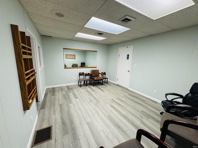 office area featuring visible vents, wood finished floors, and a paneled ceiling