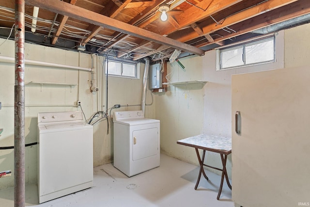 laundry area with washer and clothes dryer, electric panel, and laundry area