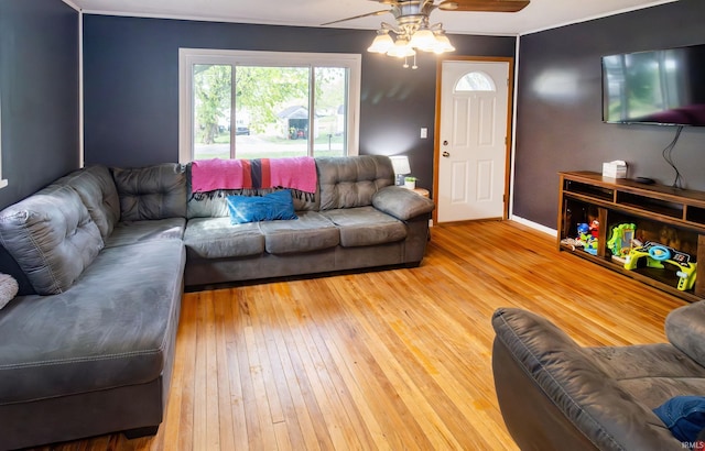 living area featuring ceiling fan and hardwood / wood-style floors
