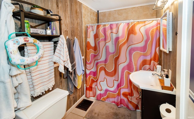 bathroom featuring wood walls, curtained shower, vanity, visible vents, and crown molding
