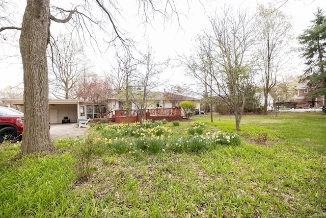view of yard featuring fence and a deck