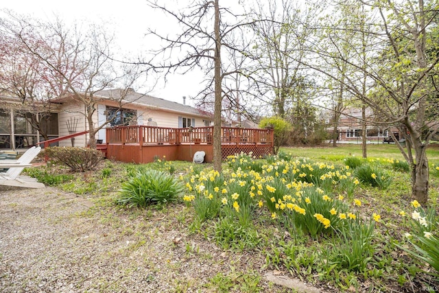 view of yard with a wooden deck