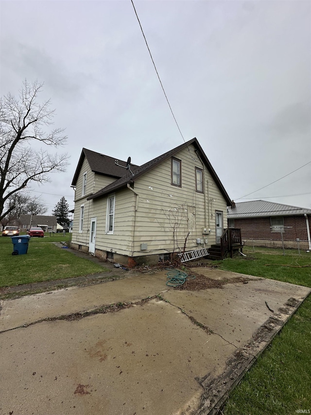 view of home's exterior with a yard