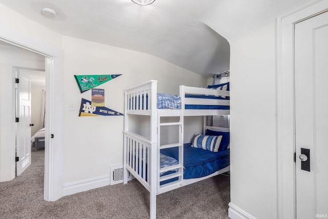 bedroom featuring visible vents, carpet flooring, vaulted ceiling, and baseboards