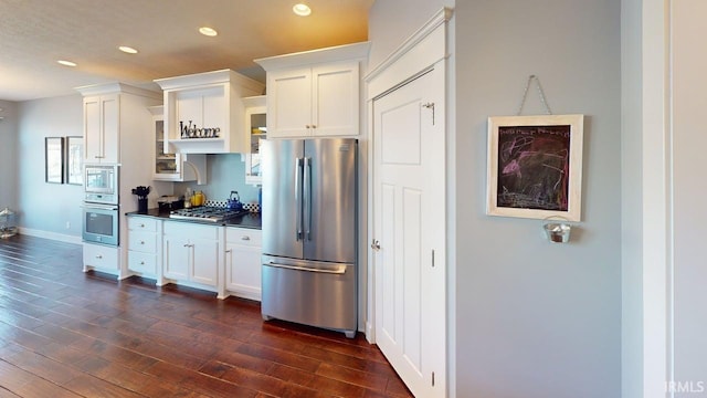 kitchen with white cabinets, recessed lighting, dark wood-style flooring, and appliances with stainless steel finishes