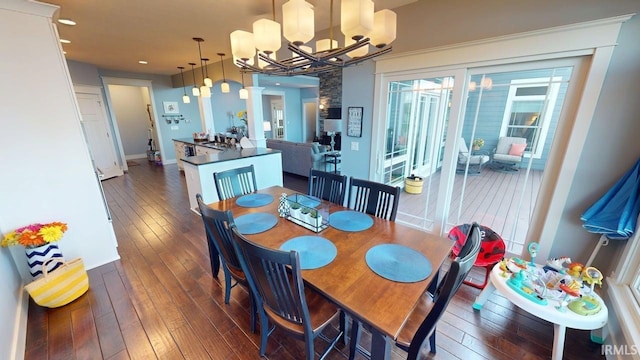 dining area with recessed lighting, a chandelier, and hardwood / wood-style flooring