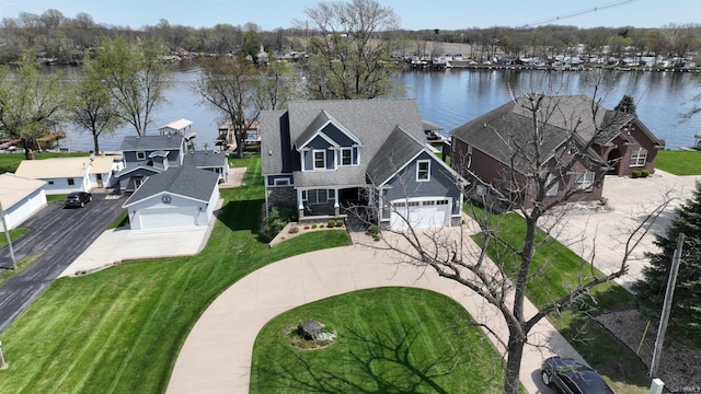 aerial view featuring a water view and a residential view