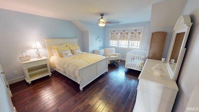 bedroom featuring baseboards and dark wood-style floors