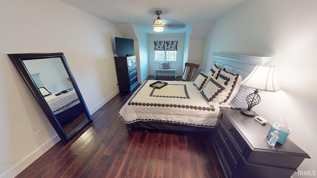 bedroom with wood finished floors and baseboards