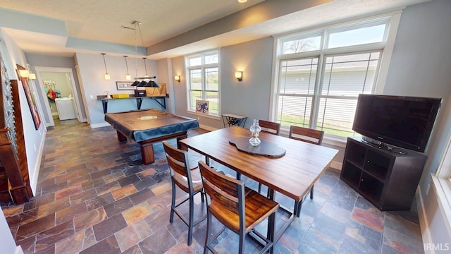 recreation room featuring pool table, a raised ceiling, stone tile flooring, and baseboards