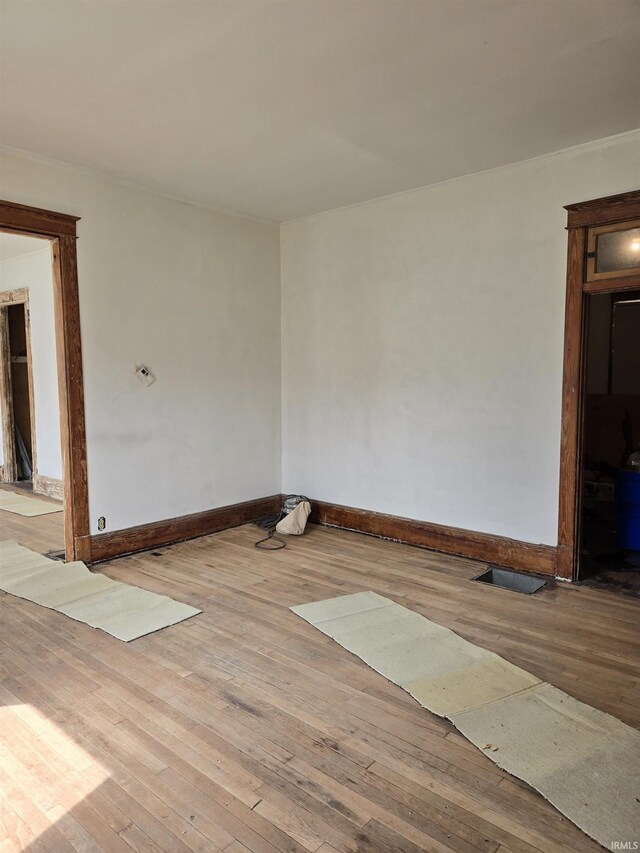 1225 Main St, Vincennes, IN 47591 - unfurnished room featuring baseboards, hardwood / wood-style flooring, and visible vents
