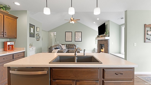 1905 Waynedale Dr, Garrett, IN 46738 - kitchen featuring a sink, a brick fireplace, visible vents, stainless steel dishwasher, and open floor plan