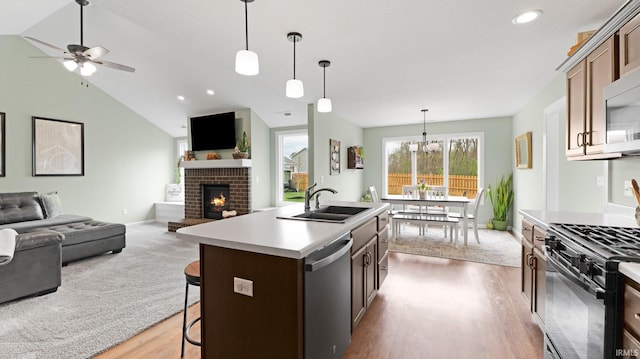 1905 Waynedale Dr, Garrett, IN 46738 - kitchen featuring open floor plan, stainless steel dishwasher, black gas range oven, and a sink