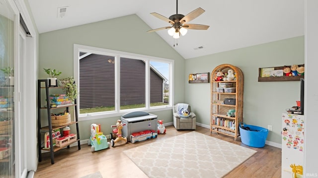 1905 Waynedale Dr, Garrett, IN 46738 - recreation room featuring visible vents, baseboards, vaulted ceiling, wood finished floors, and a ceiling fan