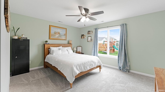 1905 Waynedale Dr, Garrett, IN 46738 - bedroom with baseboards, a ceiling fan, visible vents, and light carpet