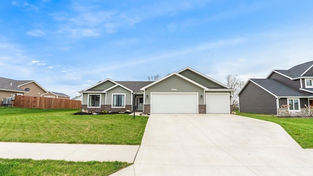 1905 Waynedale Dr, Garrett, IN 46738 - view of front facade featuring a front lawn, a garage, brick siding, concrete driveway, and fence
